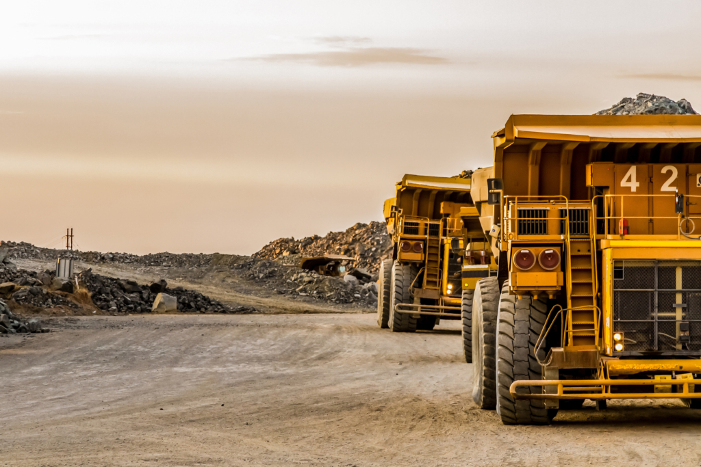 Dump Trucks transporting Platinum ore for processing
