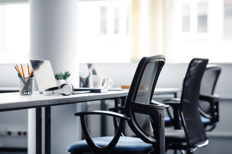 REturn to office, empty work space, office chair, image by Adobe stock