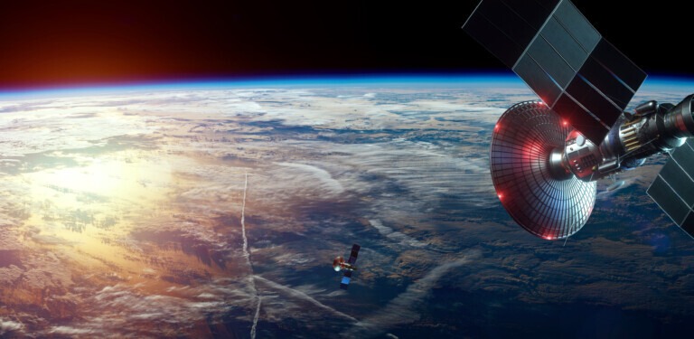 Space satellite with antenna and solar panels in space against the background of the earth. Telecommunications, high-speed Internet, space exploration. mixed medium, copy space. image furnished by NASA.